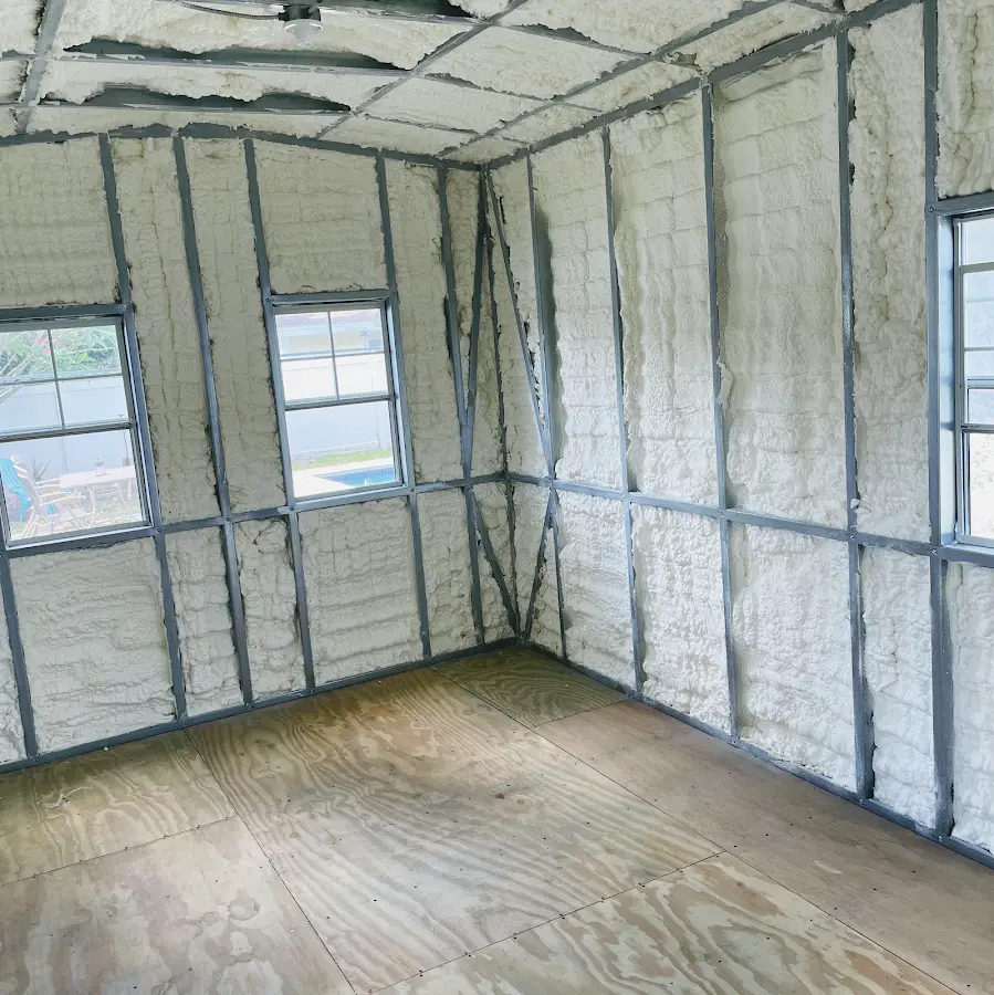 Closed-cell spray foam insulation applied to wall cavities in a residential project in Coalinga